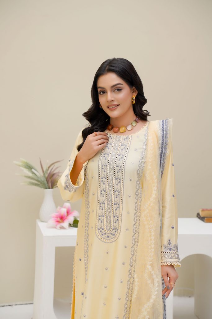 Portrait of an elegant woman in traditional Eastern dress in a Lahore studio setting.